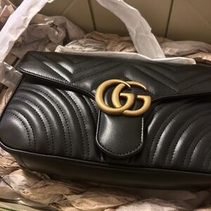 Gucci Black and Gold Quilted Leather Clutch - BRAND NEW